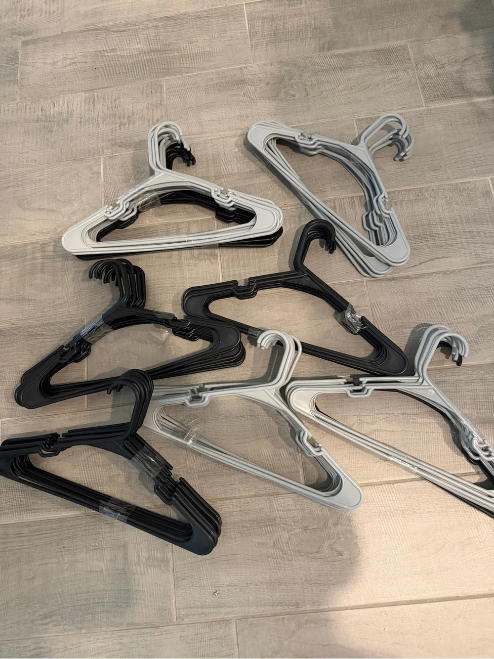 Pack of Black and Light Gray Plastic Hangers